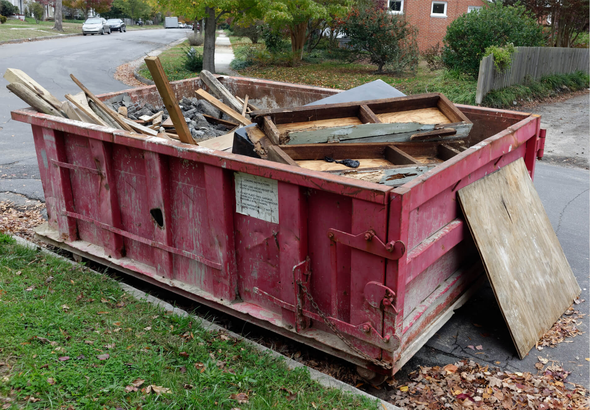 residential-debris-removal-small red dumpster on street