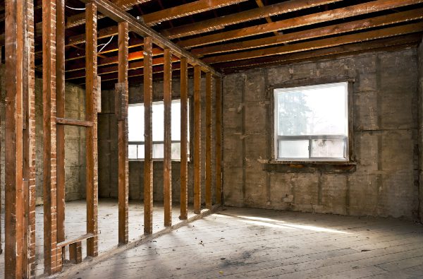Interior of a house under gut renovation at construction site Gutted interior of a home